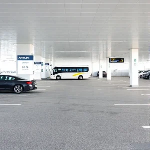 A clean, modern airport parking lot with clear signage, well-marked spaces, and a few cars parked neatly. Include a digital display showing available spots and a shuttle bus in the background. The scene is bright, organized, and user-friendly, emphasizing simplicity and ease of use.